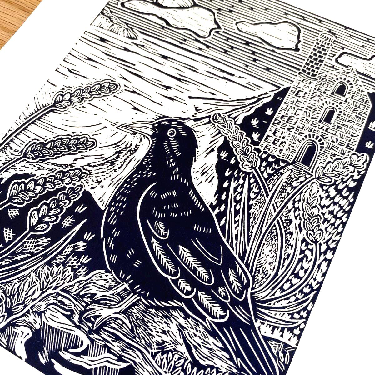 Black and white linocut print of a Cornish Chough with intricate patterns in the background by Joanna Williams Art - lino printer.
