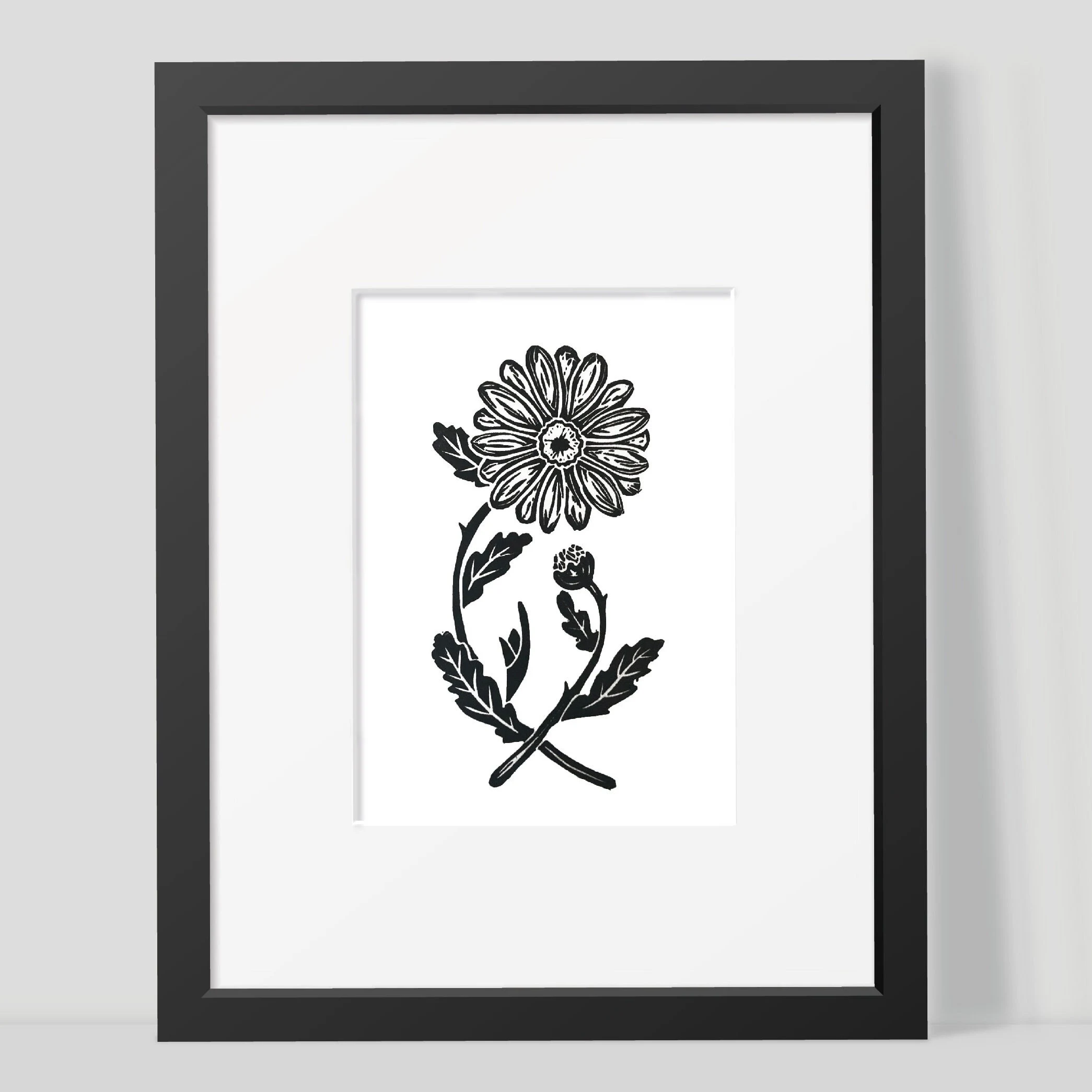 Framed black and white daisy illustration on a white background by Joanna Williams Art - lino printer.