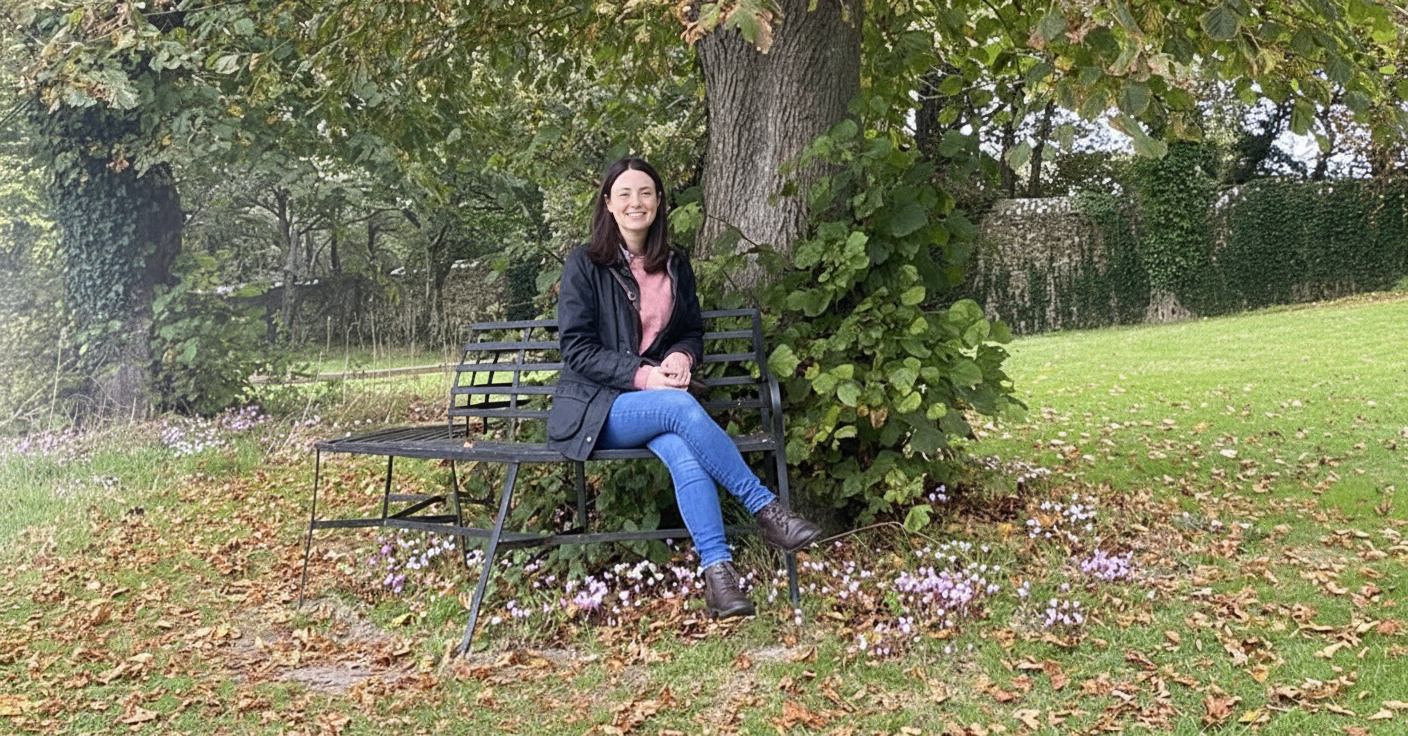 Joanna Williams lino print artist sitting on a bench in a garden