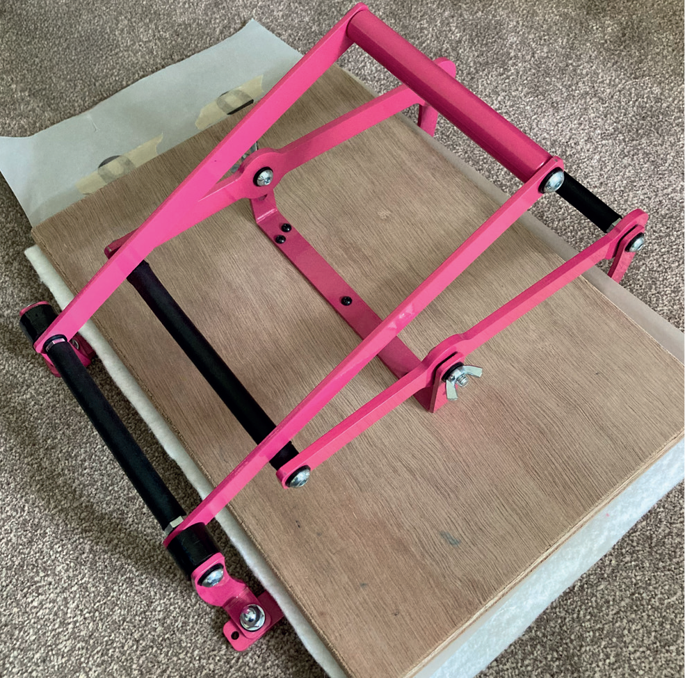 lino print process stage three of Joanna Williams' Art linocut process - printing my final design with my leaver lino printing press